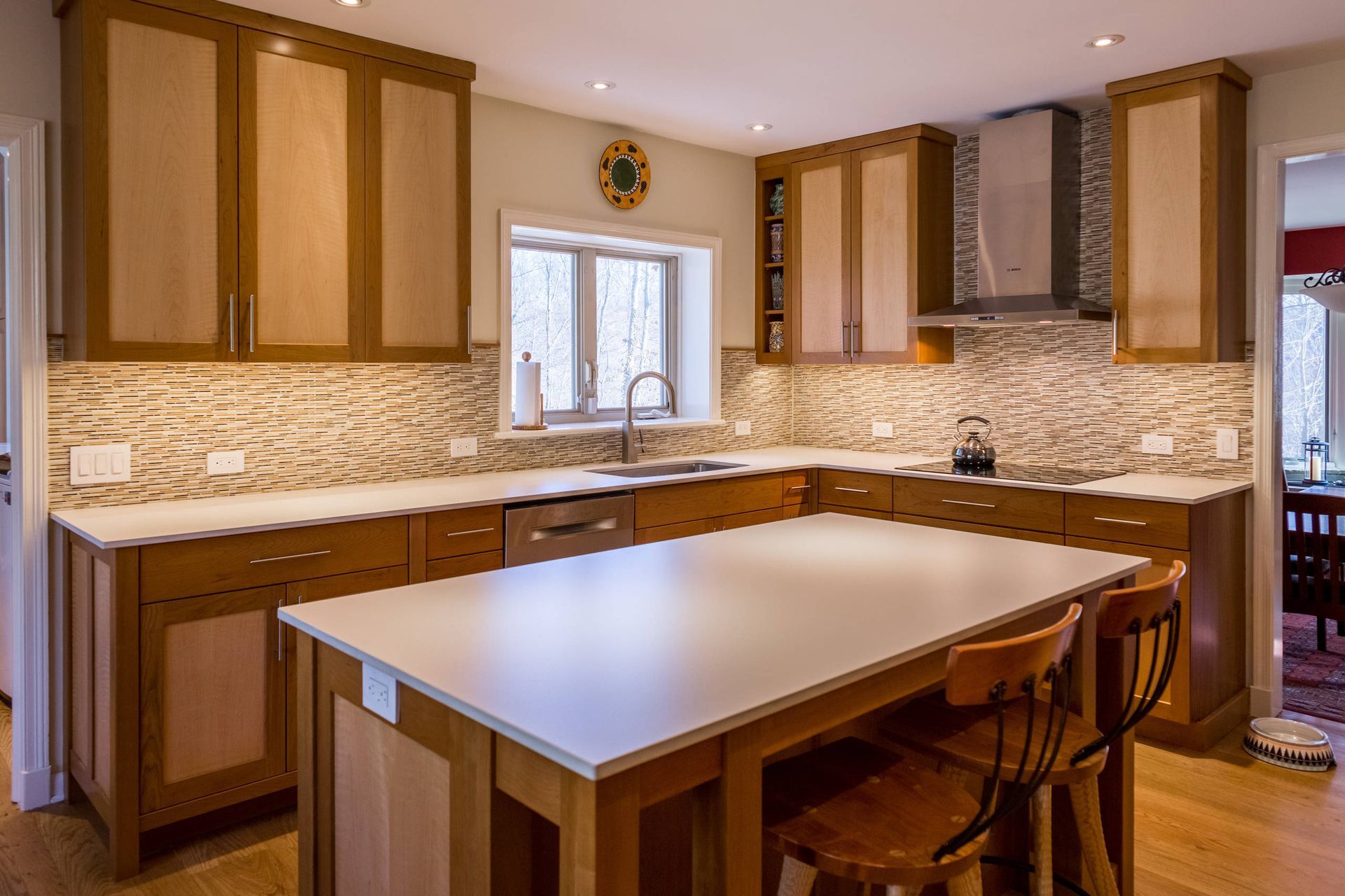 There is a large island in the middle of the kitchen.